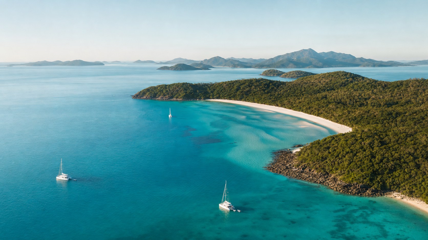 Aerial view of the Whitsunday Islands, white-sand coves and sailing yachts